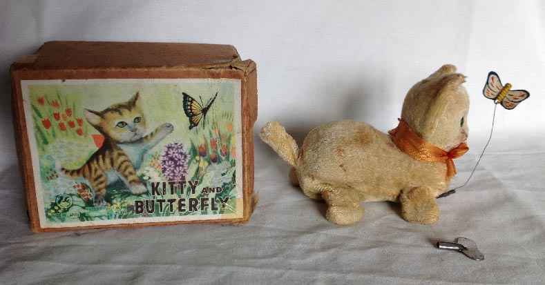 circa 1940's boxed Japanese plush covered clock work wind up Kitty and Butterfly cat toy